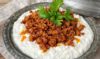 Scrumptious Ali Nazik dish with grilled eggplant, tender lamb, and creamy yogurt sauce