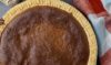 Scrumptious brown pie with a golden crust, filled with a rich and flavorful combination of ingredients.